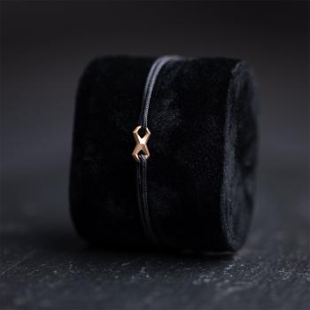 Preview: 1,5 mm schwarzes Nylonarmband mit einem bronzebeschichteten Unendlichkeitszeichen - Infinity Black Bronze